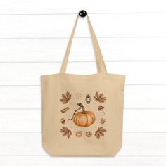 With its spacious interior and sturdy construction, this tote bag is perfect for carrying your essentials while showcasing your love for autumn. The organic cotton material provides a soft, yet durable texture, making it comfortable to carry and resistant to everyday wear and tear. Whether you're heading to a pumpkin patch, running errands, or simply enjoying a crisp autumn day, this cute tote bag is a stylish and practical companion. Its generous size accommodates groceries, books, or even your Trendy Cotton Bags For Fall, Trendy Fall Cotton Bags, Trendy Cotton Fall Bags, Fall Canvas Tote Shoulder Bag, Fall Canvas Tote Bag For Daily Use, Everyday Fall Tote Canvas Bag, Everyday Fall Canvas Tote Bag, Fall Everyday Canvas Tote Bag, Fall Tote Bag As Gift