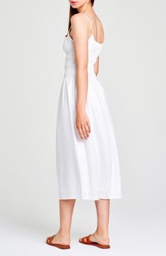 A stretchy smocked bodice shapes the silhouette of a party-ready midi sundress cut from a fresh linen blend perfect for warm weather. Scoop neck Lined 54% linen, 46% viscose Dry clean Imported Midi Sundress With Fitted Bodice For Brunch, Midi Length Sundress With Fitted Bodice For Brunch, Brunch Sundress With Fitted Bodice, Midi Length, Midi Dress With Smocked Back And Fitted Bodice, Fitted Bodice Smocked Back Midi Dress, Knee-length Midi Dress With Ruched Bodice For Summer, Fitted Bodice Midi Dress With Smocked Back, White Midi Dress With Ruched Bodice, Cotton Smocked Midi Dress For Day Out