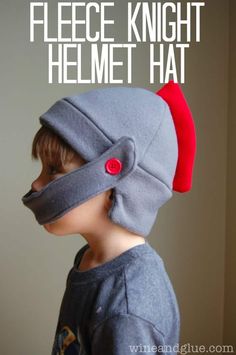 a young boy wearing a helmet with the words fleece knight helmet hat