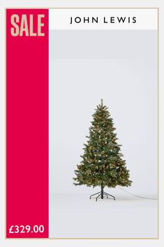 a christmas tree with lights on it for sale in front of a red and white background