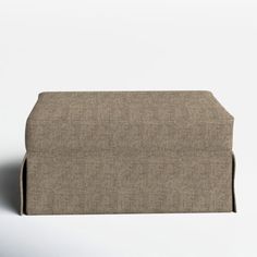 an upholstered couch is shown in front of a white background with the back end facing