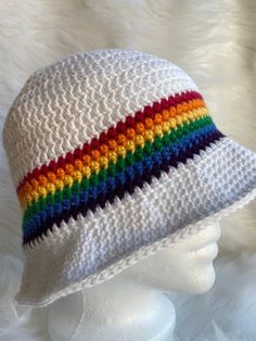 It's summertime and that means time for a nice cool bucket hat. This white hat features a bright rainbow stripe - red, orange, yellow, green, blue and purple- between the hat body and the brim. A very striking bucket hat made with 100% cotton yarn that will ensure your comfort in the warm weather and protect your head from the suns hot rays. Playful White Bucket Sun Hat, White Casual Wide Brim Hat For Festivals, Casual White Hat For Festival With Wide Brim, Fun White Cotton Sun Hat, Playful White Bucket Hat, Colorful Casual Bucket Sun Hat, Colorful Casual Bucket Hat, Casual Colorful Bucket Sun Hat, White Summer Bucket Hat