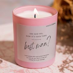 a pink candle with the words best man written on it