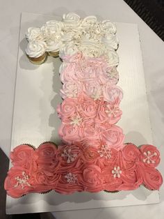 cupcakes are arranged in the shape of an eiffel tower