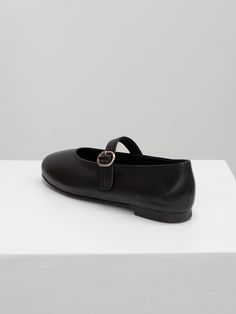 Editor's NotesTWVP presents handmade feminine shoes with high-quality materials and modern mood.- Mary-Jane shoes- Adjustable flat strap with buckle detail- Modern slim round toe - Easy slip-on design - Non-slip outsole detail Measurements(in.)- Size: KR 225MM (US 5.5) - KR 255MM (US 8.5)- Heel Height: 0.4 in.*Fits true to the sizeComposition & Care- Lambskin/ Lining: Synthetic Leather- Insole: Synthetic Leather- Avoid direct heat and moisture- Professional leather care is rec Classic Ballet Flats With Buckle Closure And Almond Toe, Classic Closed Toe Ballet Flats With Buckle, Chic Closed Toe Mary Janes With Buckle Closure, Chic Closed Toe Mary Janes With Buckle, Almond Toe Ballet Flats With Buckle For Work, Mary Jane Flats With Heel Strap And Almond Toe, Mary Jane Flats With Buckle Closure And Almond Toe, Leather Ballet Flats With Buckle Closure, Chic Black Ballet Flats With Buckle Closure