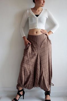 Beautiful double layer fabric made of cotton/linen blend.  High quality and stunning beauty. The fabric is unbleached and undyed, you can see the bark fibres in it! Subtle stripe patternDrop-crotch style pants, baggy pants, tribal pants with a twist.3 ways to wear. with drawstring on the hem. You can wear it with drawstring loose. Like a wide leg pants. Even look like A shape sweet skirt.You can also draw the string and get a balloon shape pants.Or...you can put the hem above your knee and get a Cotton Harem Pants For Fall, Hippie Style Cotton Pants For Fall, Fall Cotton Harem Pants, Brown Cotton Harem Pants For Fall, Fitted Cotton Harem Pants For Festivals, Cotton Harem Pants For Fall Festival, Bohemian Brown Cotton Pants, Brown Cotton Ankle-length Harem Pants, Fitted Cotton Harem Pants With Pockets