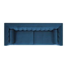 an upholstered blue couch with scalloped edges on the back and sides