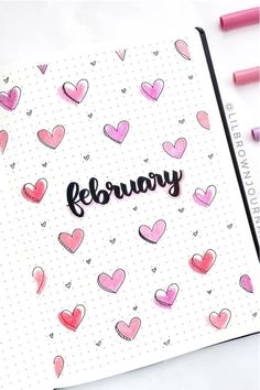 a notebook with hearts on it and the word february written in cursive writing