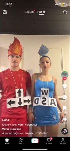 two people dressed up in costumes standing next to each other with words written on them