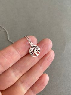 "Tiny Mini Tree of Life Silver Necklace - Sterling Silver Color : Silver Material : Sterling Silver Tree of Life Size : 12mm Chain Length : 16\" / 18\" / 20\" * Metal components are Sterling Silver. * Suitable for delicate and sensitive skin. * Comes in a jewelry box. If you need extra boxes for gifting....just let us know! Less" Silver Round Charm Necklace 16 Inch, Bee Studs, Tiny Hoop Earrings, Hamsa Necklace, Silver Tree, Silver Prices, Tree Of Life, Sterling Earrings, Bridal Earrings