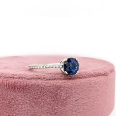 This beautiful ring features a 1.20 carat round Blue Sapphire gemstone with natural earth mined diamonds set in solid 14K gold. This Blue Sapphire makes a lovely September birthstone gift for your loved ones! This ring is made with solid 14K Gold and natural Earth mined SI / G-H diamonds. As listed, this ring is ready to ship. If you're interested in purchasing this setting with a different center stone please message us! Designer Silver Jewellery, Blue Sapphire Gemstone, Blue Sapphire Ring, Jewelry Showcases, Birthstone Gifts, September Birthstone, Blue Sapphire Rings, Natural Earth, Beautiful Ring