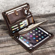 an open brown leather case on top of a wooden table