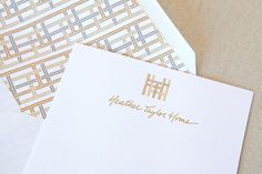 two envelopes with gold foil on them sitting next to each other and the words health today home