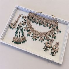 Introducing our exquisite Indian Bridal Jewelry Set, a perfect blend of tradition and elegance. This set features a stunning three piece necklaces adorned with gold finish and delicate green and gold crystal and pearl embellishments, complemented by matching earrings.  two headpieces, a choker and a necklace . Elevate your bridal look with this timeless ensemble, designed to capture the essence of Indian craftsmanship and minimalist charm. Elegant Bridal Sets With Tilla For Traditional Ceremonies, Elegant Bridal Sets For Traditional Ceremonies, Elegant Kundan Jewelry For Traditional Ceremonies, Elegant Kundan Bridal Sets For Traditional Ceremonies, Elegant Jewelry With Stone Work For Traditional Ceremonies, Elegant Jewelry For Traditional Ceremonies With Stone Work, Elegant Silver Necklace For Traditional Ceremonies, Elegant Kundan Necklace With Tilla For Ceremonies, Elegant Kundan Necklace With Tilla For Traditional Ceremonies