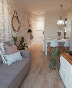 the instagram page shows an image of a living room and dining area with wood flooring