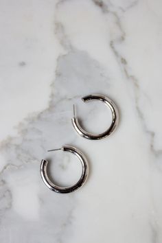 Popular gold hoop earrings available in 2 sizes and 2 finish. The chic and minimalist style fits all occasions from office to date night! So lightweight, they will become your favorite earrings! Thick Hoop Earrings, Cleveland Ohio, Christmas Wishlist, Gold Hoop, Silver Hoops, Gold Plated Silver, Gold Hoop Earrings, Silver Hoop Earrings, Minimalist Style