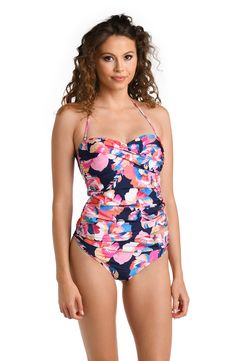 Model is wearing a multicolored Bandeau Tankini Swimsuit Top Strapless Floral Print Swimwear For Vacation, Summer Strapless Swimwear With Floral Print, Floral Print Halter Neck Tankini For Swimming, Strapless Tropical Print Swimwear For Beach Party, Spring Tankini For Pool With Lined Body, Strapless Floral Print Swimwear For Beach Party, Strapless Floral Print Swimwear For Sunbathing, Strapless Tropical Print Swimwear For Pool, Fitted Floral Print Tankini For Sunbathing