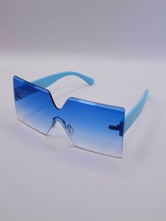 Embrace vibrant style with the Linda Clay Unisex Retro Sky Blue Colored Sunglasses! These chic shades are designed to elevate your look while providing essential eye protection. Key Features: Rimless Design: Sleek and modern, ensuring a lightweight feel and minimal obstruction. Oversized Square Frame: Offers ample coverage for your face, making a bold fashion statement. UV Protection: Safeguard your eyes from harmful rays without sacrificing style. Eye-Catching Sky Blue Color: Perfect for adding Blue Plastic Shield Sunglasses For The Beach, Blue Plastic Shield Sunglasses For Beach, Modern Blue Plastic Sunglasses, Blue Plastic Shield Sunglasses With Uva Protection, Blue Casual Shield Sunglasses For Beach, Blue Rimless Sunglasses With Uv Protection, Trendy Blue Sunglasses For Pool, Modern Blue Sunglasses For Vacation, Blue Mirrored Shield Sunglasses For Beach