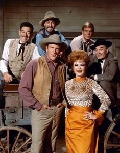 the cast of gunsmoke posing for a photo