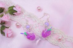 ~🍬 ♡~ These Cute Purple color earrings  Perfect accessory for girl , for women~♡   ★~ The size of the earrings- Height x 5cm(1.96in) width 2cm(0.78in) ★ These Cute earrings are adorable, Glow in the Dark,  they are made with  Silver plated Hooks Earrings , Acrylic Candy Beads, Cute resin pendant. ★These earrings are safe and comfortable even for girls with delicate, sensitive skin. ★ Handmade earrings delicate and durable.  Perfect accessory for girls , for women~♡ ~♡ ~ Nice gift for yourself or your loved ones. ♥ ~ Sent in gentle packaging-  in gift box+regular box. All orders would be shipped within 1 - 2 business days. ♥ Photos are in high quality. Fine details are visible. ♡ ~ Handmade with love ~♡ Candy Beads, Faux Leather Bracelets, Cocktail Drink, Earrings Acrylic, Color Earrings, Satin Roses, Pretty Roses, Purple Earrings, Cute Cups