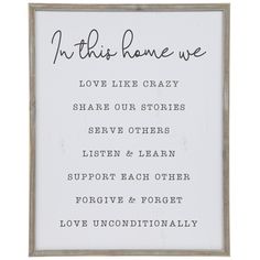 a framed sign that says, in this home we love like crazy share our stories serve others listen learn support each other