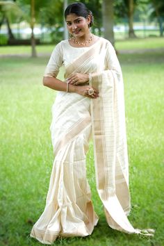 Elegance and charm is what you will exude once you get this white silk saree which comprises an elegant ethnic look.This round neck and half sleeve blouse is highlighted with woven zari work.It is teamed up with a silk light weight saree in white color elaborated using woven zari work.This blouse can be customised up to the maximum size available in inches 44 around the bust. Slight color variation may occur due to photographic reasons. White Silk Saree, Half Sleeve Blouse, Zari Work, White Silk, Raw Silk, Half Sleeve, Silk Fabric, Silk Saree, Half Sleeves