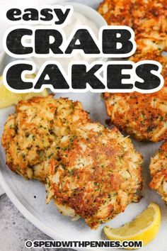 crab cakes on a white plate with lemon wedges and the title overlay reads easy crab cakes