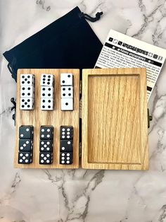 a wooden board game set with dices in it