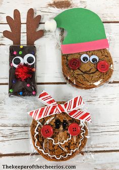 three decorated cookies in the shape of reindeers