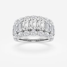 a white gold ring with baguetts and diamonds on top, set in 18k white gold