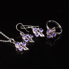 925 Sterling Silver Set Natural Tanzanite Jewelry Set, Bridal Jewelry Set Ring,Earrings,Pendant, For Gift ✔✔Metal Material-Solid 925 Sterling Silver ✔✔Stone Measurement is 4 MM ✔✔Natural Tanzanite And Side White Topaz Is Used ✔✔3.60-4 CT Approx. Weight Of Stone ✔✔ Total Weight Is 7.50 Grams ✔✔ Free Silver Chain  December Birthstone ✔✔Please note that there Can be slight variations in stone texture and color shades in the actual product that you receive. Stone quality or grade will be same. Becau Sterling Silver Fine Jewelry Sets For Anniversary, Fine Sterling Silver Jewelry Sets For Anniversary, Anniversary Fine Jewelry Sets In Sterling Silver, Fine Jewelry Sterling Silver Jewelry Sets, Sterling Silver Fine Jewelry Sets, Silver Gemstone Fine Jewelry Sets, Hallmarked Silver Cubic Zirconia Jewelry Sets, Silver Sterling Silver Jewelry Sets For Anniversary, Fine Jewelry Hand Set Sterling Silver Sets