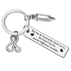 a keychain with an inscription on it that says may you be proud of the world