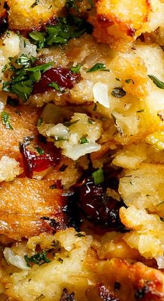 a close up of food on a plate with herbs and other things to eat in it