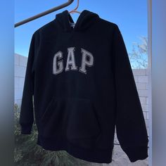 Gap Kids Fleece Pullover Hoodie Nwt Size Large (10) Unisex Color: Black W/ Grey Stitched Gap Lettering Kangaroo Pockets Waffle Knit Lined Hood Gap Fleece Sweatshirt For Streetwear, Gap Crew Neck Hoodie For Winter, Gap Crew Neck Winter Hoodie, Gap Hoodie With Letter Print For Winter, Gap Winter Hoodie With Letter Print, Winter Gap Hoodie With Letter Print, Gap Fleece Hooded Tops, Gap Long Sleeve Fleece Sweatshirt, Gap Fleece Hoodie