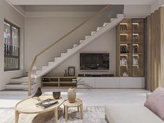 a modern living room with stairs leading up to the second floor