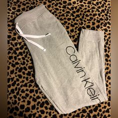 Grey Comfy Lounge Pants Never Worn Calvin Klein Cotton Bottoms With Elastic Waistband, Casual Calvin Klein Relaxed Fit Pants, Stretch Cotton Calvin Klein Bottoms, Calvin Klein Stretch Cotton Bottoms, Sporty Calvin Klein Cotton Bottoms, Calvin Klein Bottoms With Elastic Waistband, Sporty Fitted Calvin Klein Bottoms, Calvin Klein Relaxed Fit Cotton Pants, Calvin Klein Casual Loungewear Pants