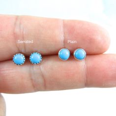 A darling pair of simple Turquoise Stud Earrings in Sterling Silver.These earrings are made with a 5mm Turquoise stone and sterling silver.Your choice of either a plain bezel or serrated bezel.Your earrings will come with sterling silver butterfly backs.Mix and match with my other stud earrings.*Please note as with all natural gemstones the color may vary from the pair shown.Great for sensitive ears!This listing is for one pair of earrings. Earrings are shipped in a gift box. Turquoise Birthstone Round Earrings, Turquoise Round Birthstone Earrings, Dainty Turquoise Earrings For Gift, Minimalist Turquoise Earrings For Everyday Wear, Dainty Turquoise Earrings As Gift, Minimalist Turquoise Earrings For Everyday, Minimalist Hypoallergenic Turquoise Earrings, Tiny Blue Minimalist Earrings, Dainty Nickel-free Turquoise Earrings