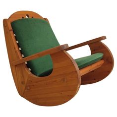 a wooden rocking chair with green cushion on it's seat and backrests