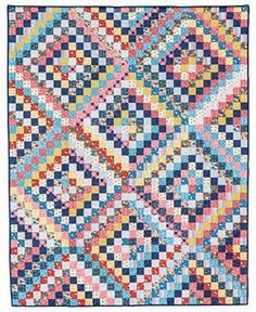 a multicolored quilt is displayed on a white background and it has squares in the middle