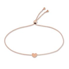 A meaningful heart station shimmers elegantly in the center of this timeless women's bolo bracelet. Fashioned in 14K rose gold, the cable chain secures in place with a bolo clasp. Fine Jewelry Rose Gold Heart Bracelets, Rose Gold Heart Bracelets Fine Jewelry, Rose Gold Heart Bracelet In Fine Jewelry Style, Elegant Heart Bracelet With Adjustable Chain, Rose Gold Heart Bracelet Fine Jewelry, Adjustable Rose Gold Jewelry With Heart Charm, Adjustable Rose Gold Heart Bracelet For Valentine's Day, Elegant Rose Gold Bracelet With Sliding Knot, Rose Gold Adjustable Bracelet For Everyday