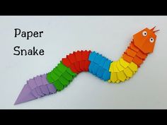 a colorful paper snake made out of folded origami pieces with the words paper snake on it