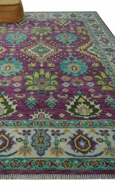 Expertly hand-knotted from high-quality wool, this traditional Oushak area rug features a stunning color palette of purple, ivory, green, and aqua. Measuring 9x12 feet, it adds a touch of elegance and warmth to any room. Elevate your decor with this timeless and durable piece. Hand-Knotted Size : 9 feet by 12 feet Made with Wool Color: Purple, Ivory, Green and Aqua Made with 22 knots per square inch This specific rug is made in India, in the city of Bhadohi. Bhadohi is one of the biggest rug manufacturing cities. Carpet weaving in the region dates back to the 16th century during the reign of Akbar. The skilled artisans of Bhadohi have been carrying the tradition of rug-making for centuries. USERS GUIDE Avoid prolonged moisture Vacuum regularly and/or shake to remove dust Do not pull any lo Green Couch, 9x12 Area Rugs, Living Room Color Schemes, Big Rugs, Living Room Green, Boho Bedroom, Purple Rug, Traditional Techniques, Room Colors