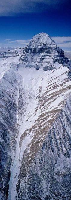 an aerial view of a snow covered mountain