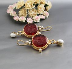 ✽ D E T A I L S   {Gemstone} - Red Glass   {Gemstone Size} - 18 mm    {Earring Height Including Hoop} - 5.5 cm   {Earring Width} - 2.8 cm   {Finish} - Smooth and high polished with brilliant shine.   {Note} -The earrings are made to order, production day is about 3-5 working days. The one you receive may be slight different from the one                  in the picture due to handmade nature, but it will be almost same as in the above picture.    These pieces are handcrafted from start to finish Temple Jewelry Earrings As Gift, Round Temple Jewelry Earrings, Elegant Round Temple Jewelry Earrings, Temple Jewelry Pierced Earrings For Formal Occasions, Temple Jewelry Style Bridal Earrings As A Gift, Elegant Oval Earrings As Gift, Yellow Gold Temple Jewelry Pearl Earrings, Round Gemstone Bridal Earrings For Celebration, Elegant Round Bridal Earrings As Gift