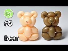 two teddy bears made out of balloons sitting next to each other