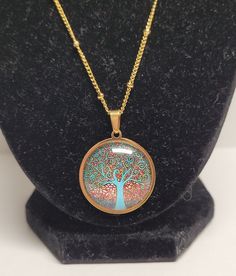 Stainless steel gold tree of Life necklace Width: 2 1/2cm Height: 2 1/2cm Chain length: 19 1/2 Nickel-free Gold Plated Spiritual Necklaces, Gold Copper Necklace As A Gift, Personalized Gold Copper Necklace, Copper Necklace With Adjustable Chain For Gift, Rose Gold Spiritual Necklace, Personalized Bronze Metal Jewelry, Spiritual Round Metal Charm Necklaces, Adjustable Jewelry With Tree Of Life Round Pendant, Cadmium-free Metal Round Pendant Jewelry