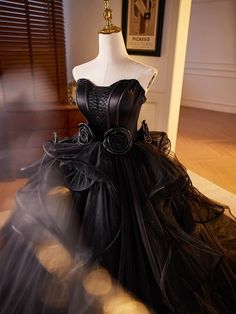 Embrace your inner gothic princess with this exquisite wedding dress. Crafted with meticulous attention to detail, this gown combines comfort and style. Black Wedding Ball Gown With Boned Bodice, Black Wedding Gown With Boned Bodice, Black Strapless Ball Gown For Wedding, Black Floor-length Corset Dress For Prom Season, Black Tulle Corset Dress For Wedding, Black Corset Dress For Wedding And Prom Season, Floor-length Black Corset Dress For Wedding, Black Ball Gown Corset Dress For Prom, Black Strapless Gown With Corset Back