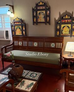 a living room filled with furniture and pictures on the wall