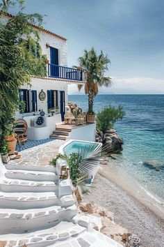 stairs lead up to the beach with blue shutters and palm trees on either side