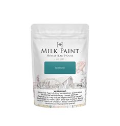 a bag of milk paint sitting on top of a white table